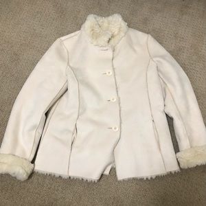 Reversible cream coloured faux fur jacket.
